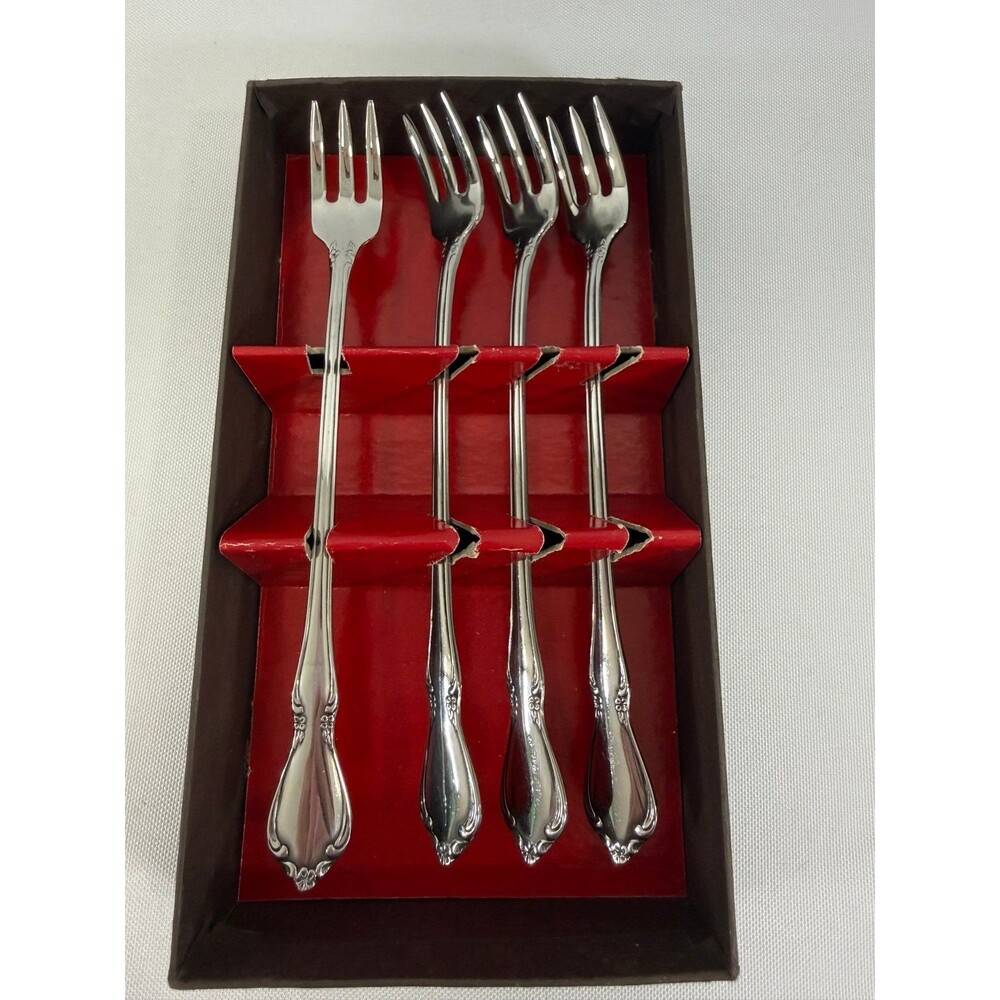 four cocktail forks in the Chateau pattern by Oneida Stainless Steel In box